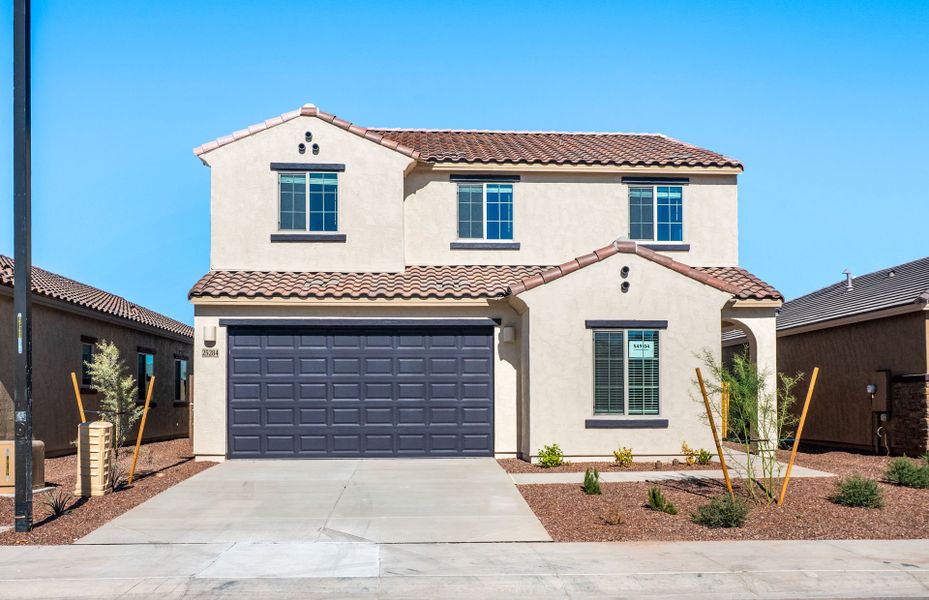 Front exterior of a new home in Copper Falls, Buckeye, AZ, highlighting curb appeal (Image 17).