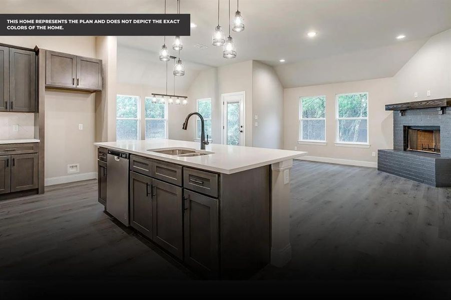 Kitchen featuring a kitchen island with sink, sink, a healthy amount of sunlight, and lofted ceiling