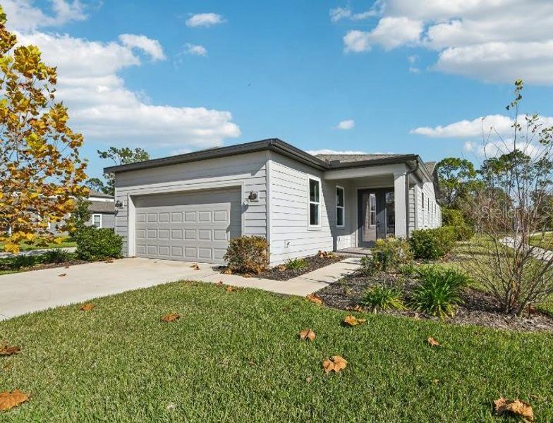 Front exterior of a new home in Northlake Classical, Winter Garden, FL, highlighting curb appeal (Image 23). Front exterior of a new home in Northlake Classical, Winter Garden, FL, highlighting curb appeal (Image 23).