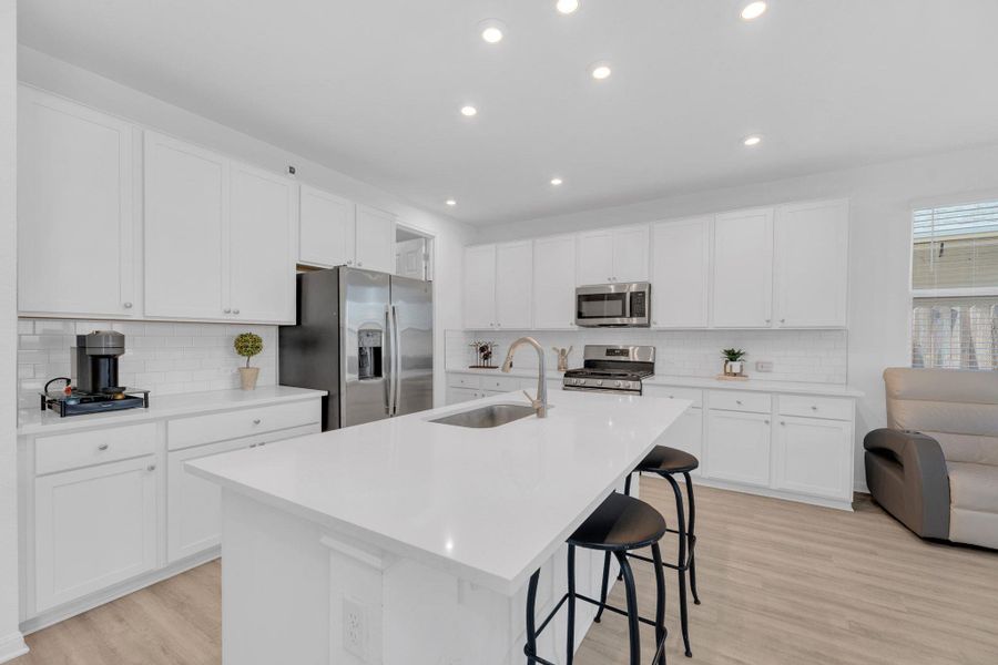 Furnished interior view inside a new home in Seasons at Carillon, Manor (Image 7).
