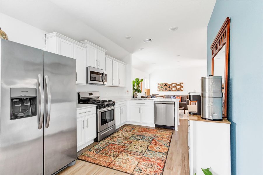 Kitchen view back through to the family room.