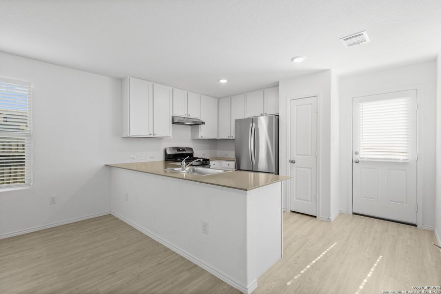 Furnished interior view inside a new home in Ruby Crossing: Cottage Collection, San Antonio (Image 6).