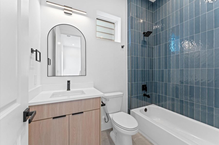 Thoughtfully designed guest bath featuring timeless materials and upscale touches Thoughtfully designed guest bath featuring timeless materials and upscale touches