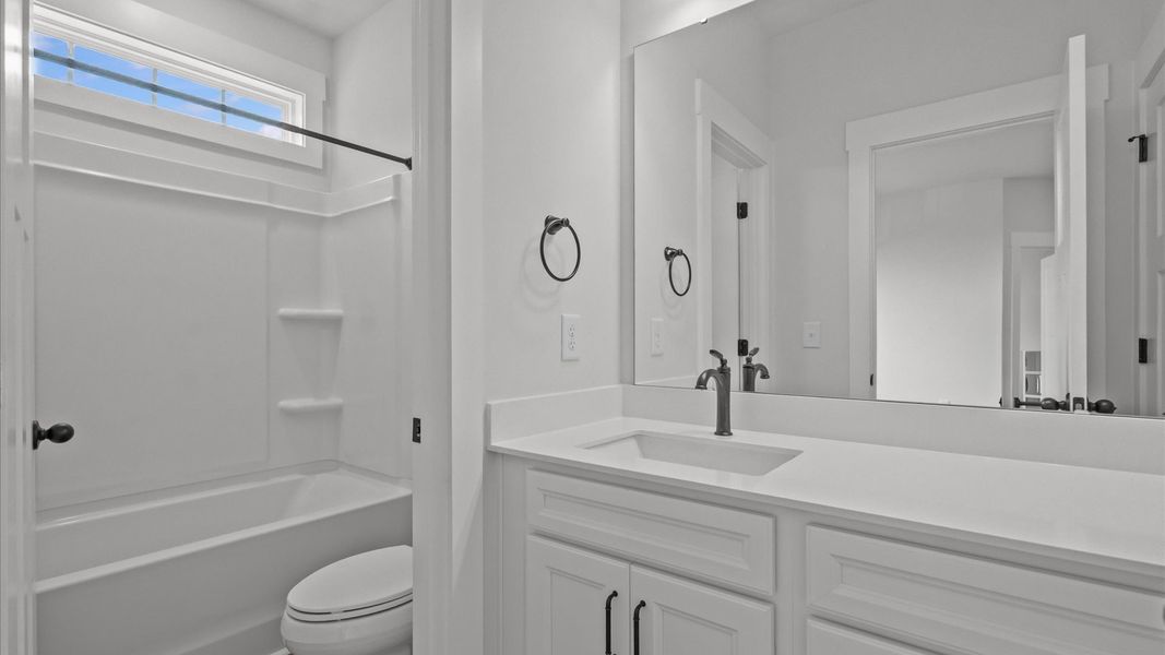 Notable full bathroom offering tasteful details and a bright, functional space