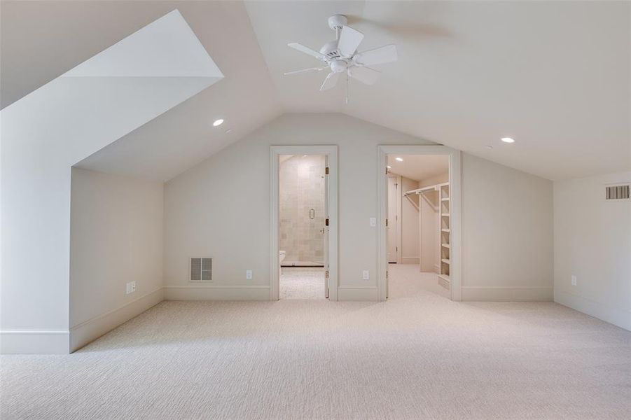 Bonus room featuring light carpet, lofted ceiling, recessed lighting, and a ceiling fan Bonus room featuring light carpet, lofted ceiling, recessed lighting, and a ceiling fan