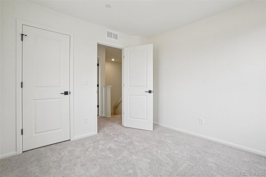 Spacious, unfurnished interior of a new home in The Nest Villas at Canyon Creek, Erie (Image 6).