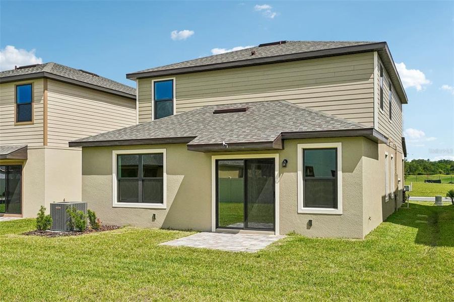 Exterior details and patio area of a home in Grasslands West, Lakeland (Image 26).