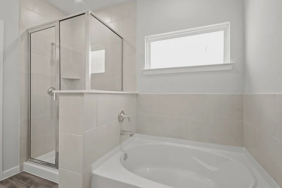 A bathroom with a glass shower.