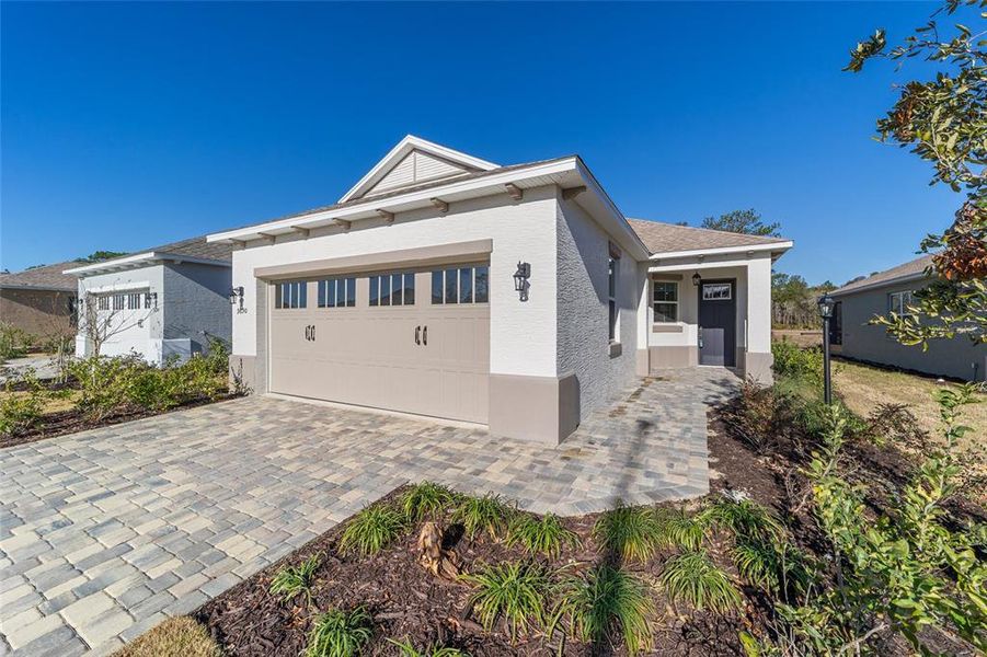 Exterior details and patio area of a home in On Top of the World Communities, Ocala (Image 3).