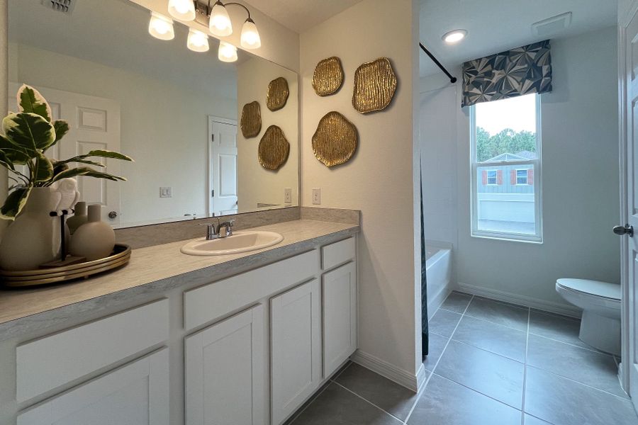 Ashley townhome model in Pine Meadows, Eustis FL — elegant two-story home with 4 bedrooms, 3 baths, and 1,898 sq. ft. of living space. Featuring an open-concept kitchen, dining, and living area, this modern townhome offers flexible layouts for families, guests, or a home office. Highlights include a spacious primary suite with private bath, second-floor laundry, covered lanai, and welcoming entry porch. Built with energy efficiency and stylish design, the Ashley townhome blends comfort, functionality, and charm in a sought-after Central Florida community.