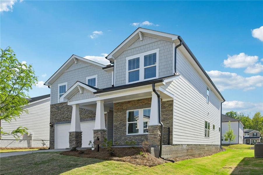 Front exterior of a new home in Vines at Mill Creek - Estate Series, Braselton, GA, highlighting curb appeal (Image 28).