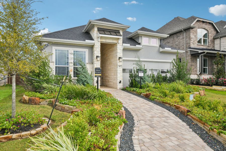 Front exterior of a new home in Wood Leaf Reserve, Tomball, TX, highlighting curb appeal (Image 25).