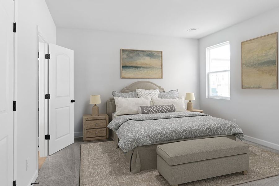 A bedroom with a bed and a bench. A bedroom with a bed and a bench.