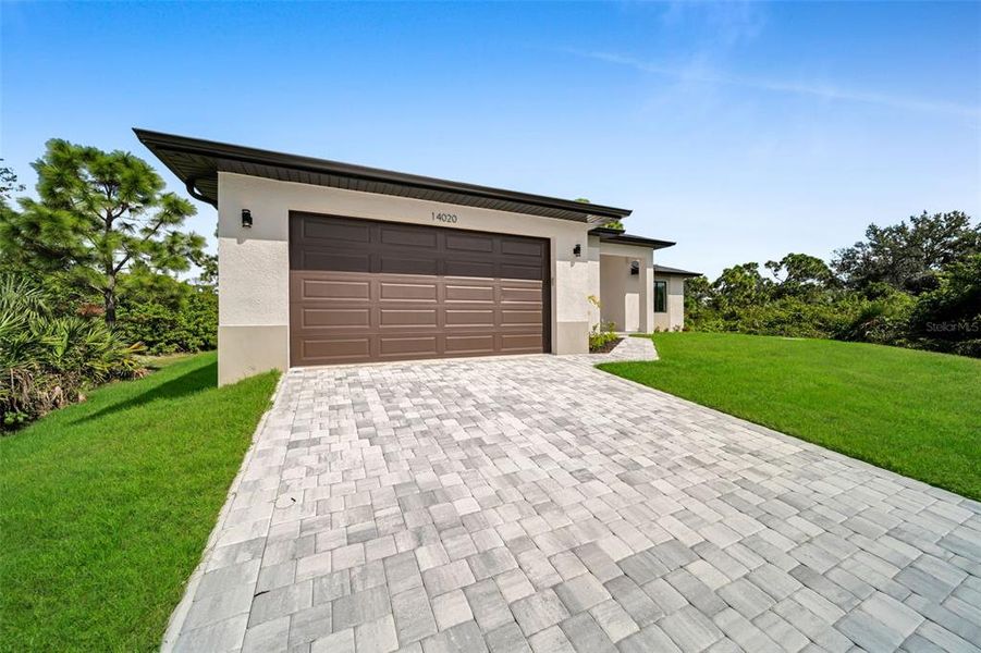 Front exterior of a new home in , Port Charlotte, FL, highlighting curb appeal (Image 2). Front exterior of a new home in , Port Charlotte, FL, highlighting curb appeal (Image 2).