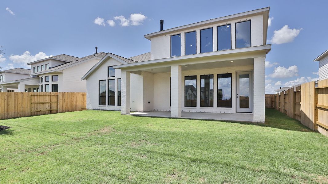 Exterior details and patio area of a home in Lakes of Cane Island, Katy (Image 3).