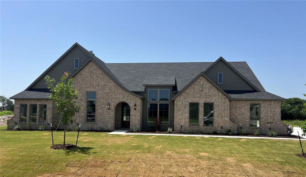 Front exterior of a new home in , Midlothian, TX, highlighting curb appeal (Image 1). Front exterior of a new home in , Midlothian, TX, highlighting curb appeal (Image 1).
