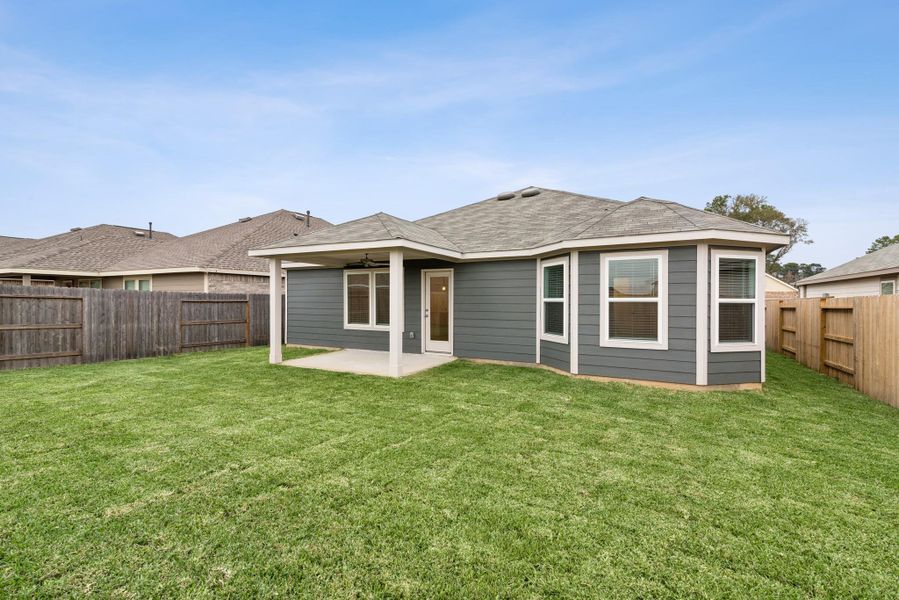 Exterior details and patio area of a home in Pinewood at Grand Texas, New Caney (Image 4). Exterior details and patio area of a home in Pinewood at Grand Texas, New Caney (Image 4).