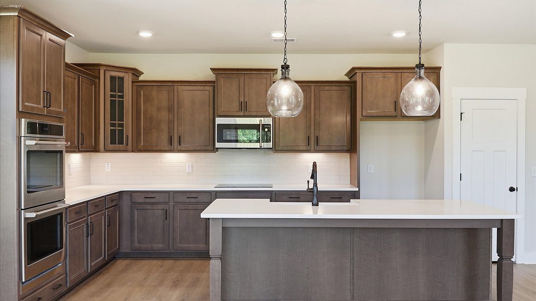 Beautifully appointed kitchen with spacious counters and sophisticated detailing in the growing Woodruff, SC