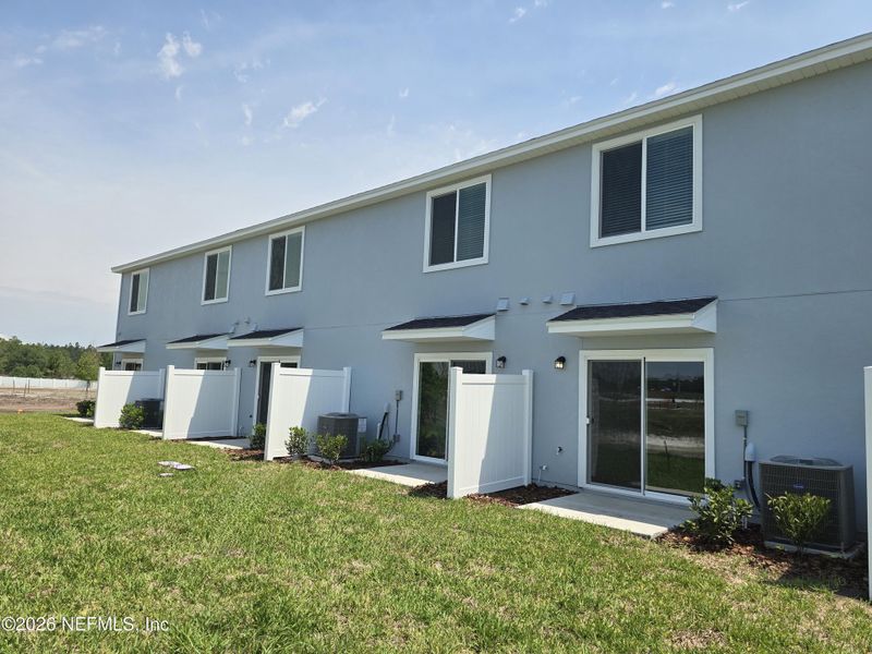 Exterior details and patio area of a home in The District at Oakleaf - The Commons, Middleburg (Image 3).