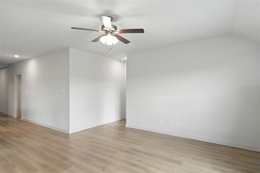 Unfurnished room with light wood-style floors, ceiling fan, and recessed lighting Unfurnished room with light wood-style floors, ceiling fan, and recessed lighting