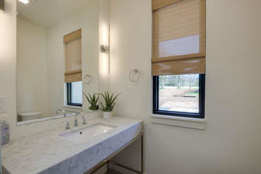 Bathroom with vanity and plenty of natural light