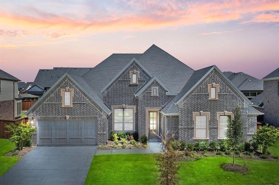 Front exterior of a new home in Windsong Ranch, Prosper, TX, highlighting curb appeal (Image 2). Front exterior of a new home in Windsong Ranch, Prosper, TX, highlighting curb appeal (Image 2).