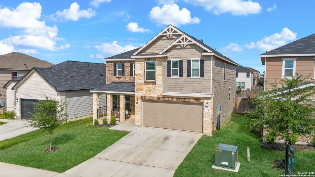 Front exterior of a new home in Champions Landing, San Antonio, TX, highlighting curb appeal (Image 2). Front exterior of a new home in Champions Landing, San Antonio, TX, highlighting curb appeal (Image 2).