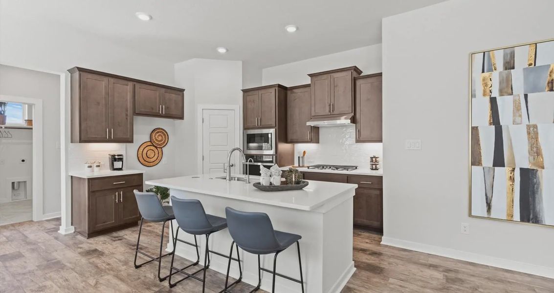 Representative furnished interior of a home built from the Avril by Chesmar Homes in Stream Waters, Buda (Image 17).