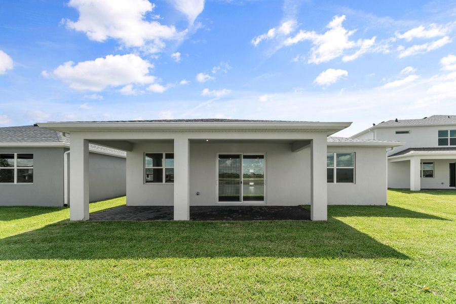 Front exterior of a new home in Tradition - Cadence, Port St. Lucie, FL, highlighting curb appeal (Image 2).