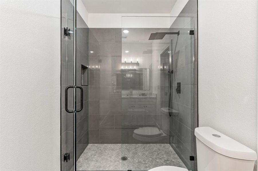 Bathroom with toilet and walk in shower