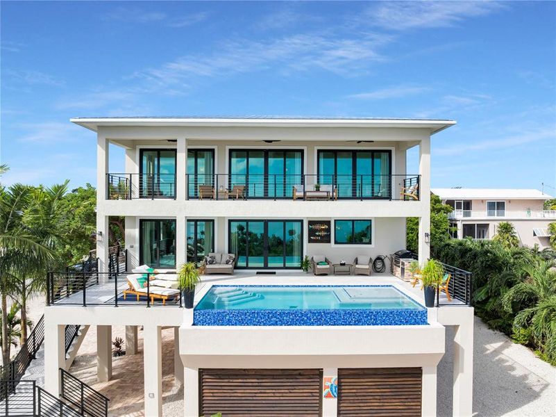 Front exterior of a new home in , Marathon, FL, highlighting curb appeal (Image 26). Front exterior of a new home in , Marathon, FL, highlighting curb appeal (Image 26).