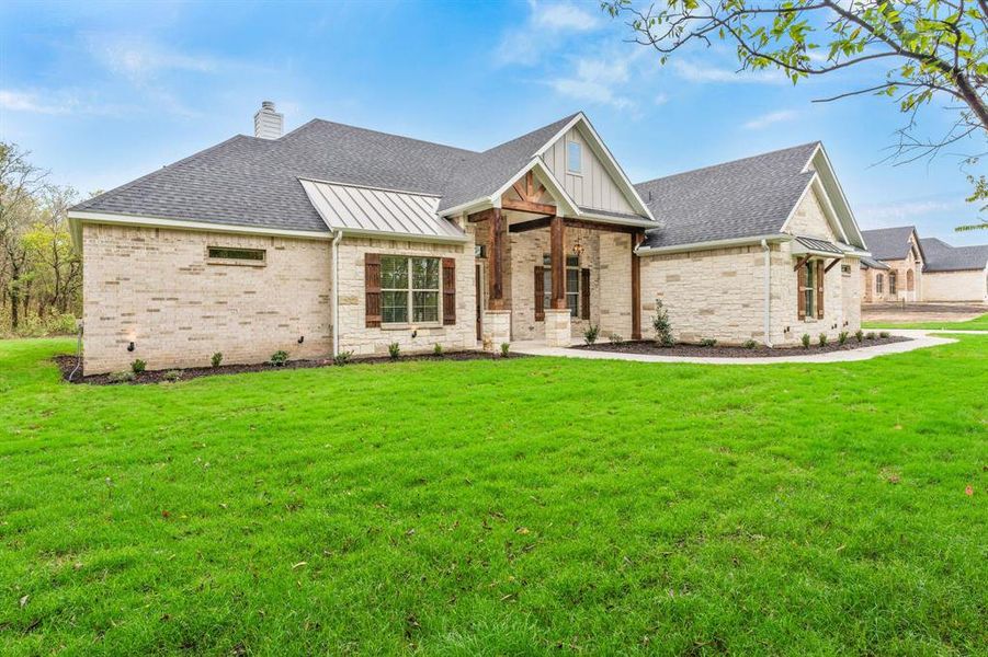 View of front of home with a front yard