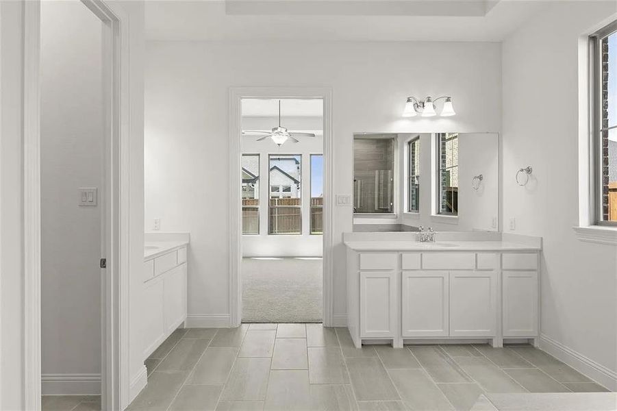 Bathroom featuring vanity and tile patterned floors