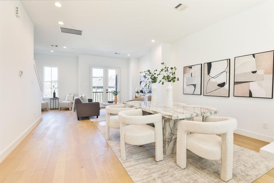 Picture yourself dining with friends and family in this spacious, open second-floor living area. To the right, a dry bar with ample storage is perfect for your decor, dishes, and more. Picture yourself dining with friends and family in this spacious, open second-floor living area. To the right, a dry bar with ample storage is perfect for your decor, dishes, and more.