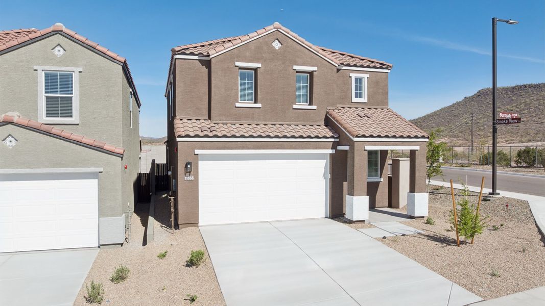 Front exterior of a new home in The Buttes at Mystic, Peoria, AZ, highlighting curb appeal (Image 25).