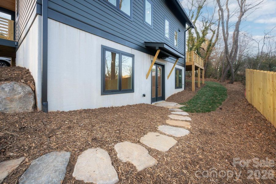 Laid-Stone Path Leads to Lower-Level Entrance