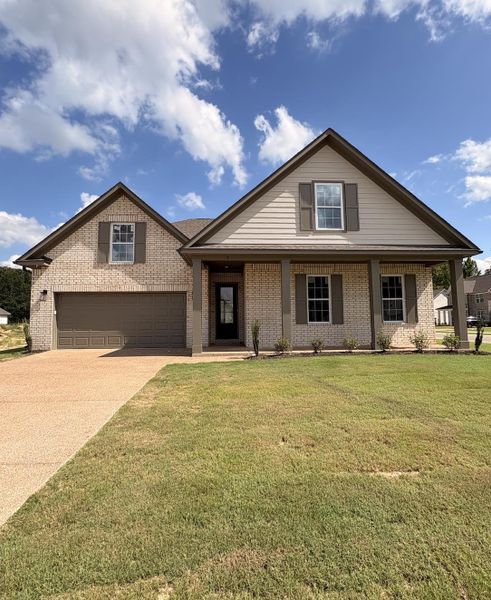 Traditional-style residence featuring a brick and siding exterior, an attached two-car garage, and a covered front entry with columns Traditional-style residence featuring a brick and siding exterior, an attached two-car garage, and a covered front entry with columns