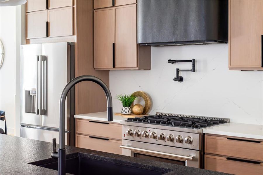 Pot filler, custom vent hood, more cabinets than you can count - all that's missing is the chef!