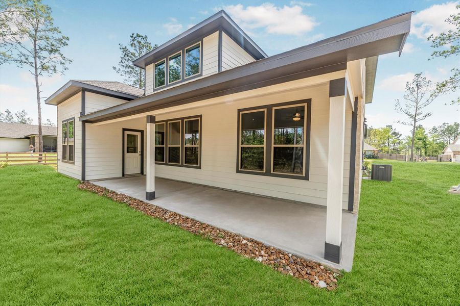 Exterior details and patio area of a home in Deer Pines, Conroe (Image 26).