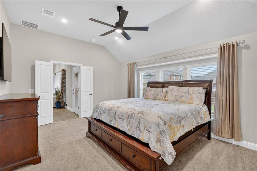 Vaulted ceiling bedroom with a contemporary ceiling fan and recessed lighting Vaulted ceiling bedroom with a contemporary ceiling fan and recessed lighting