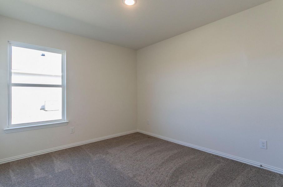 Empty room with baseboards and carpet floors