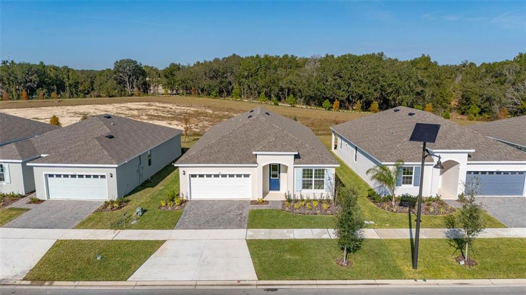 Front exterior of a new home in Reserve at Hammock Oaks, Lady Lake, FL, highlighting curb appeal (Image 2). Front exterior of a new home in Reserve at Hammock Oaks, Lady Lake, FL, highlighting curb appeal (Image 2).