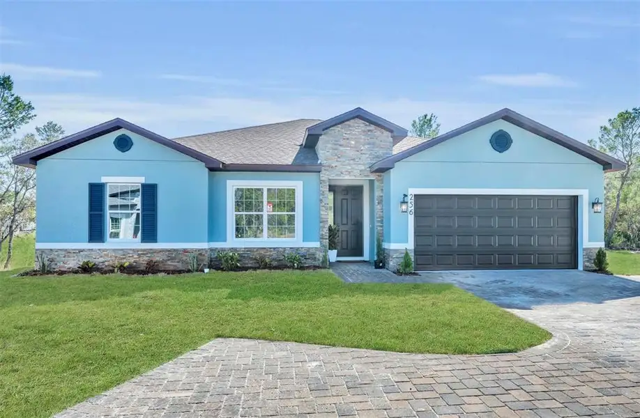 Front exterior of a new home in , Poinciana, FL, highlighting curb appeal (Image 1). Front exterior of a new home in , Poinciana, FL, highlighting curb appeal (Image 1).