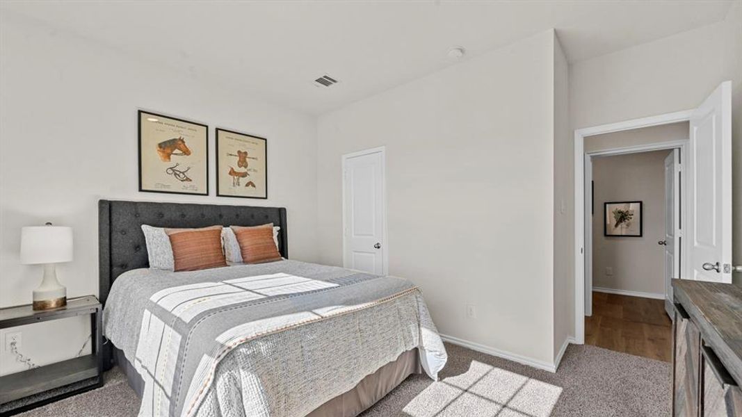 This inviting room features soft carpet flooring, a spacious layout, and a private closet This inviting room features soft carpet flooring, a spacious layout, and a private closet