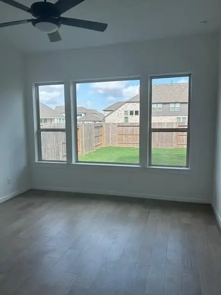 Hard wood floors in the primary bedroom a plus.