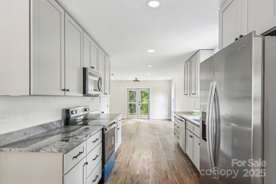 Furnished interior view inside a new home in , Waynesville (Image 8).