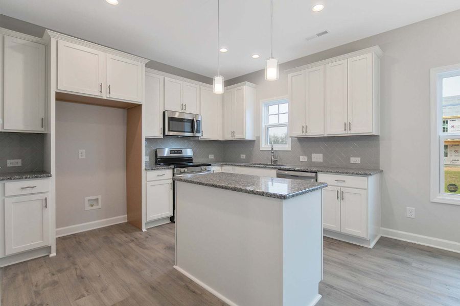 Representative furnished interior of a home built from the Magnolia by Caviness & Cates Communities in Bartlett Manor, Youngsville (Image 163).
