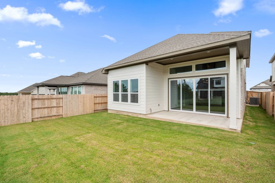 Exterior details and patio area of a home in Lariat, Liberty Hill (Image 27).