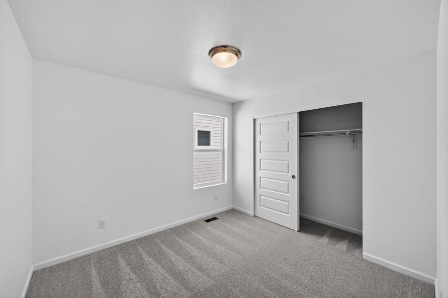 Spacious, unfurnished interior of a new home in Sky Ranch, Aurora (Image 15).