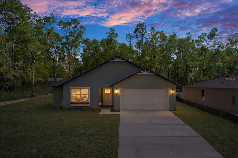 Front exterior of a new home in , Inverness, FL, highlighting curb appeal (Image 30).